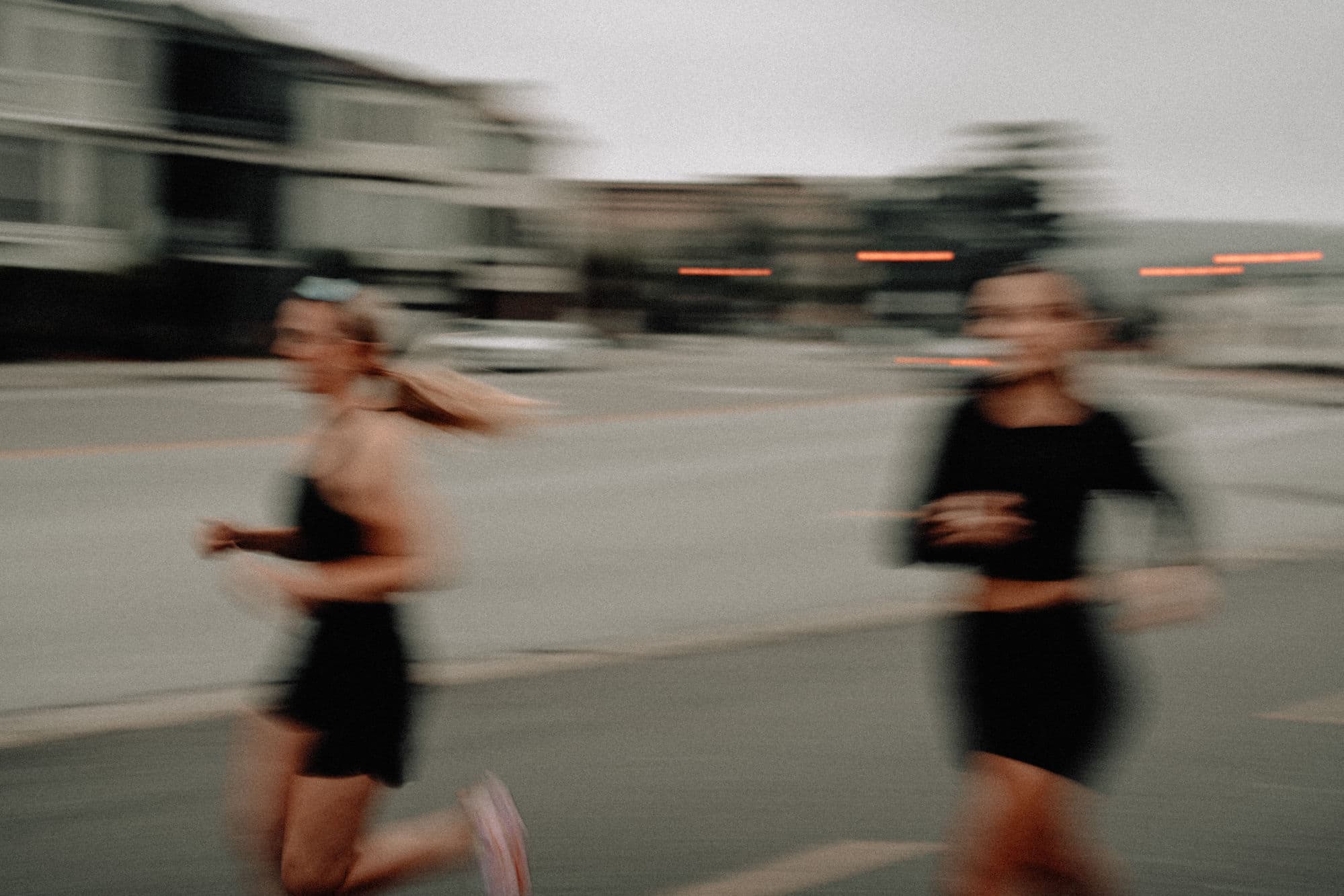 Marina Run Club members running through the neighborhood at dusk